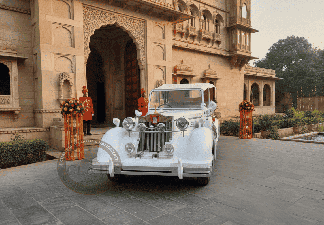 Beautifully maintained classic white vintage car parked outdoors.